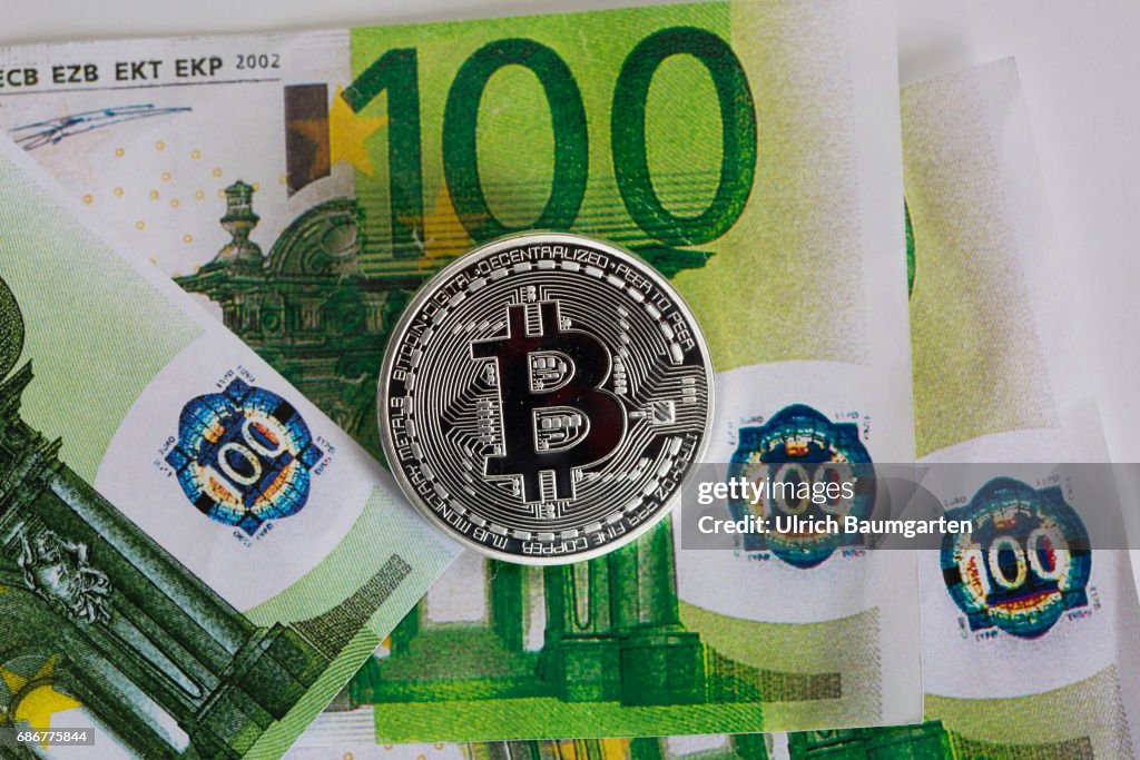 Bitcoin physically on euro banknotes.