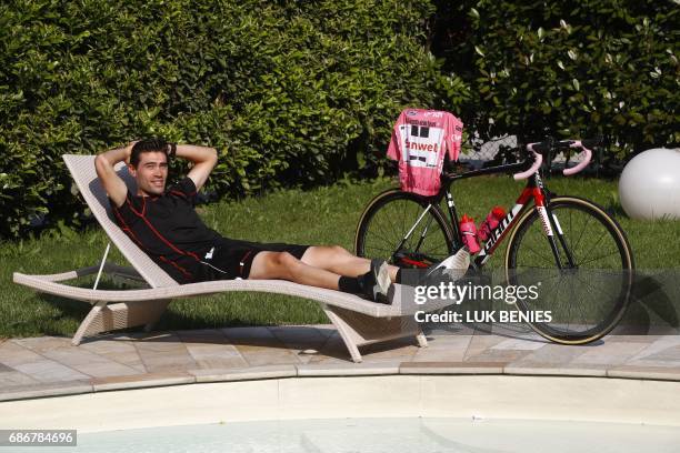 Pink Jersey Tom Dumoulin of Netherlands poses by the pool after a press conference on May 22, 2017 in Boario Terme, during a rest day of the 100th...