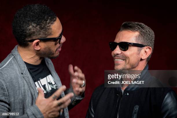 French rappers of the band Supreme NTM, Didier Morville, aka JoeyStarr , and Bruno Lopes, aka Kool Shen , pose during a photo session in Paris on May...