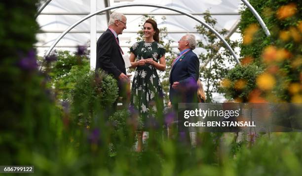 Britain's Catherine, Duchess of Cambridge talks with exhibitors as she views a parterre at the Hillier garden display at the Chelsea Flower Show in...