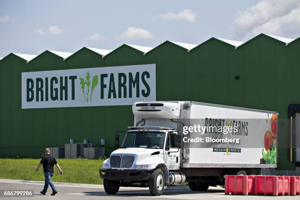 Man walks past a truck parked in front of the BrightFarms Inc. Chicagoland greenhouse in Rochelle, Illinois, U.S., on Friday, May 12, 2017. The...