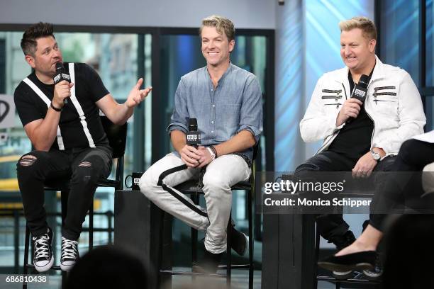 Musicians Jay DeMarcus, Joe Don Rooney and Gary LeVox of band Rascal Flatts speak on stage at Build presents Rascal Flatts promoting their new album...