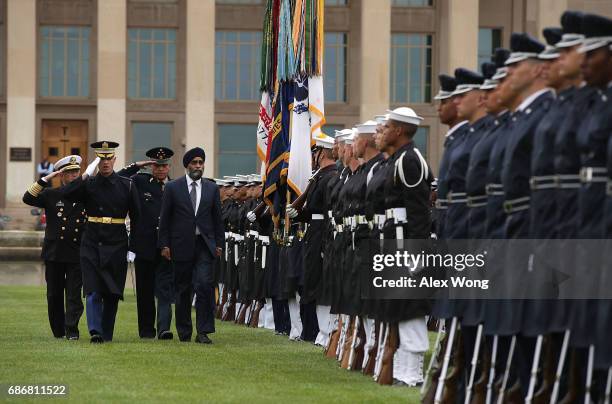 Escorted by Regimental Commander of U.S. Army 3rd Infantry Regiment Col. Jason Garkey , Canadian Minister of National Defence Harjit Sajjan , Mexican...