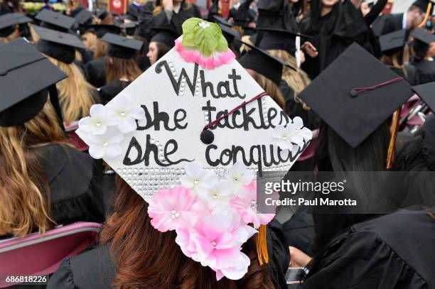 Decorated Commencement Caps at the Boston College 2017 141st Commencement Exercises at Boston College Alumni Stadium on May 22, 2017 in Boston,...