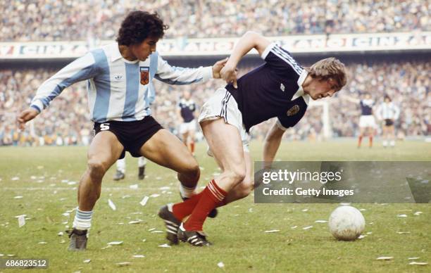 Scotland player Kenny Dalglish competes for a loose ball with an Argentina defender during a friendly International between Argentina and Scotland at...