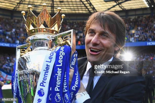Antonio Conte, Manager of Chelsea poses with the Premier League Trophy after the Premier League match between Chelsea and Sunderland at Stamford...