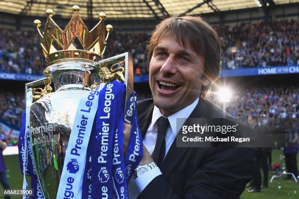 Antonio Conte, Manager of Chelsea poses with the Premier League Trophy after the Premier League match between Chelsea and Sunderland at Stamford...