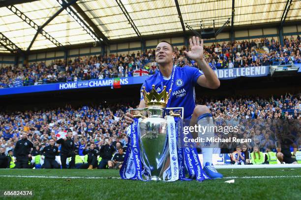 John Terry of Chelsea poses with the Premier League Trophy after the Premier League match between Chelsea and Sunderland at Stamford Bridge on May...