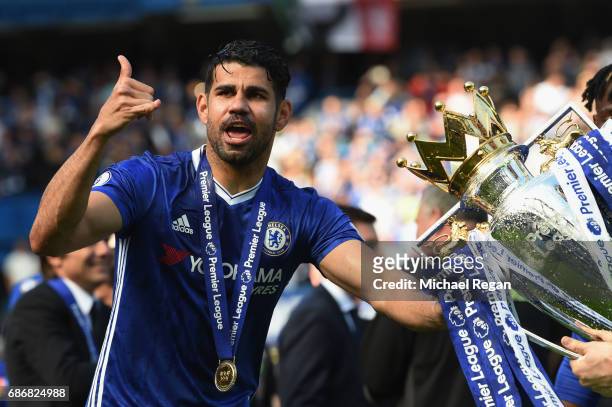 Diego Costa of Chelsea poses with the Premier League Trophy after the Premier League match between Chelsea and Sunderland at Stamford Bridge on May...
