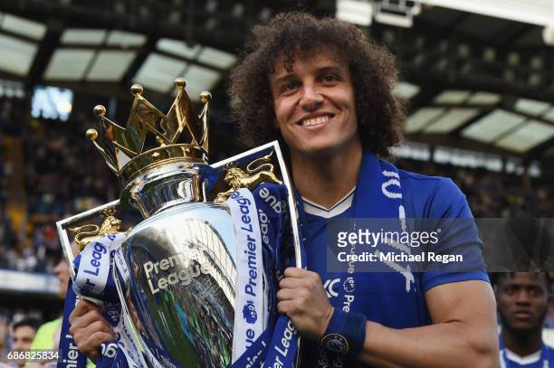 David Luiz of Chelsea poses with the Premier League trophy after the Premier League match between Chelsea and Sunderland at Stamford Bridge on May...