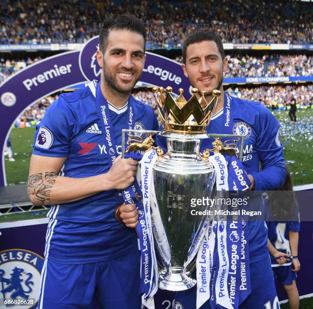 Cesc Fabregas and Eden Hazard of Chelsea pose with the Premier League trophy after the Premier League match between Chelsea and Sunderland at...