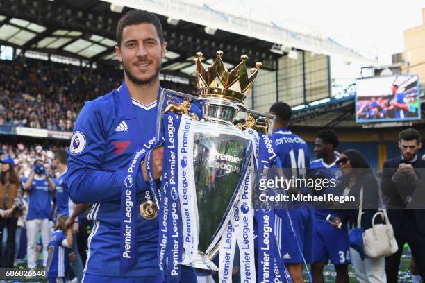 Eden Hazard of Chelsea poses with the Premier League trophy after the Premier League match between Chelsea and Sunderland at Stamford Bridge on May...