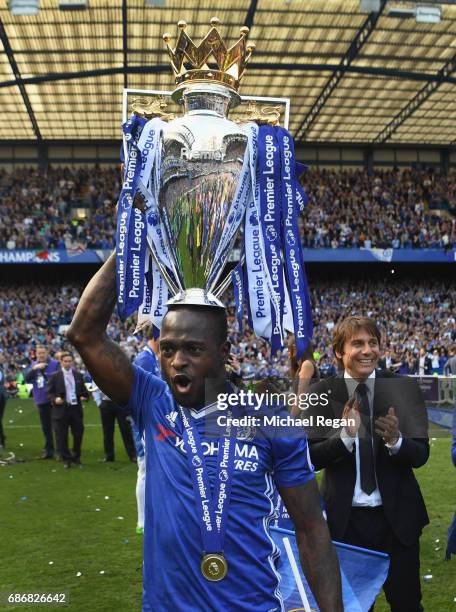 Victor Moses of Chelsea poses with the Premier League Trophy after the Premier League match between Chelsea and Sunderland at Stamford Bridge on May...