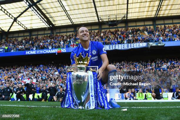 John Terry of Chelsea poses with the Premier League Trophy after the Premier League match between Chelsea and Sunderland at Stamford Bridge on May...