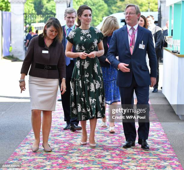 Catherine, Duchess of Cambridge , talks with Royal Horticultural Society judge Mark Fane as she arrives at the RHS Chelsea Flower Show press day at...