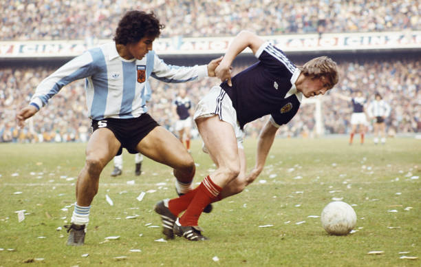 Scotland player Kenny Dalglish is fouled by Argentina player Americo Gallego during a friendly International between Argentina and Scotland at the...