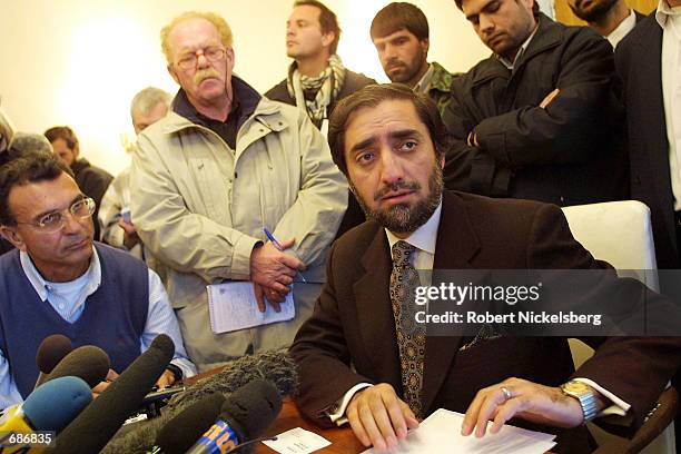 Northern Alliance Foreign Minister Dr. Abdullah reads off the interim government cabinet results from the 5-day Bonn meeting of Afghan factions...