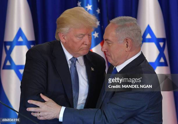 President Donald Trump and Israel's Prime Minister Benjamin Netanyahu shake hands after delivering press statements prior to an official dinner in...