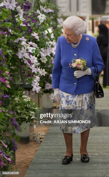 Britain's Queen Elizabeth II visits the Chelsea Flower Show in London on May 22, 2017. The Chelsea flower show, held annually in the grounds of the...
