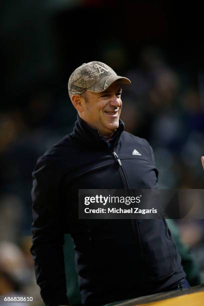 Managing Partner and Board Member John Fisher of the Oakland Athletics stands in the stands during the game against the Los Angeles Angels of Anaheim...