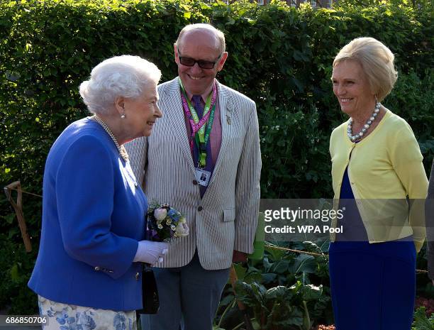 Queen Elizabeth II meets Mary Berry at the BBC Radio 2 Garden at the RHS Chelsea Flower Show press day at Royal Hospital Chelsea on May 22, 2017 in...