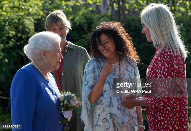 Queen Elizabeth II meets Anneka Rice at the BBC Radio 2 Garden at the RHS Chelsea Flower Show press day at Royal Hospital Chelsea on May 22, 2017 in...