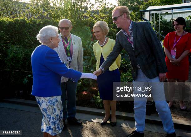 Queen Elizabeth II meets Chris Evans and Mary Berry at the BBC Radio 2 Garden at the RHS Chelsea Flower Show press day at Royal Hospital Chelsea on...