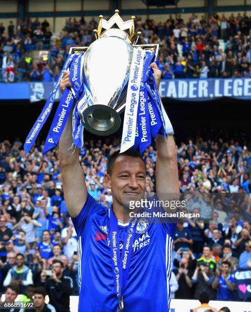 John Terry of Chelsea poses with the Premier League Trophy after the Premier League match between Chelsea and Sunderland at Stamford Bridge on May...