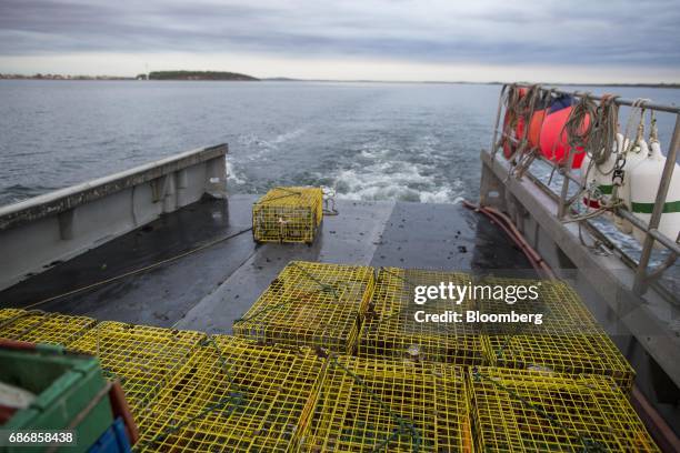 Freshly baited lobster pot sits aboard a boat before it is pulled into the waters off of Hull, Massachusetts, U.S., on Wednesday, May 17, 2017. New...