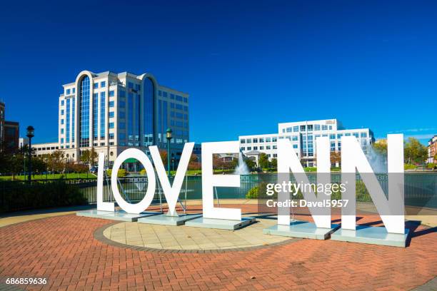 newport news "love nn" sign and city center - hampton stock pictures, royalty-free photos & images