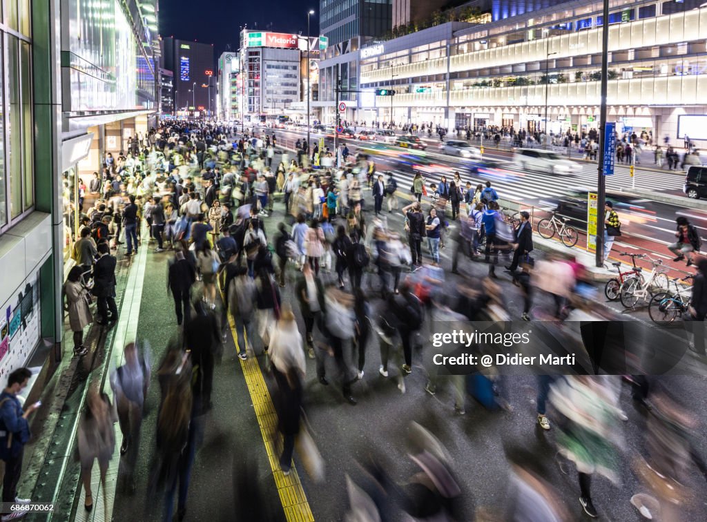 Crowd in front of the busy Shinjuku station in Tokyo