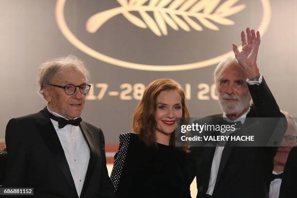 French actor Jean-Louis Trintignant, French actress Isabelle Huppert and Austrian director Michael Haneke pose as they arrive on May 22, 2017 for the...