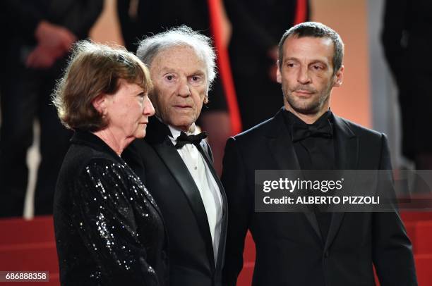 French actor Jean-Louis Trintignant , his wife Marianne Hoepfner and French actor Mathieu Kassovitz arrive on May 22, 2017 for the screening of the...