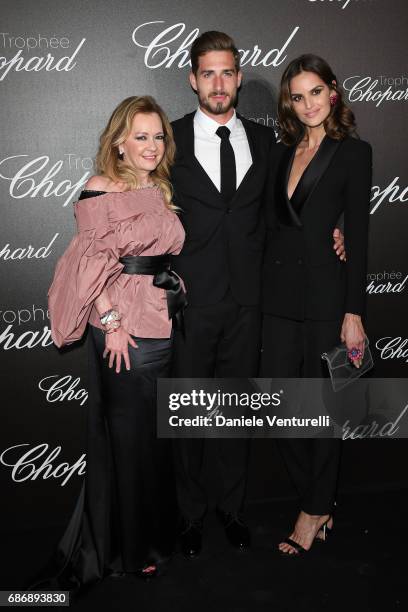 Caroline Scheufele, Kevin Trapp and Izabel Goulart attend the Chopard Trophy photocall at Hotel Martinez on May 22, 2017 in Cannes, France.