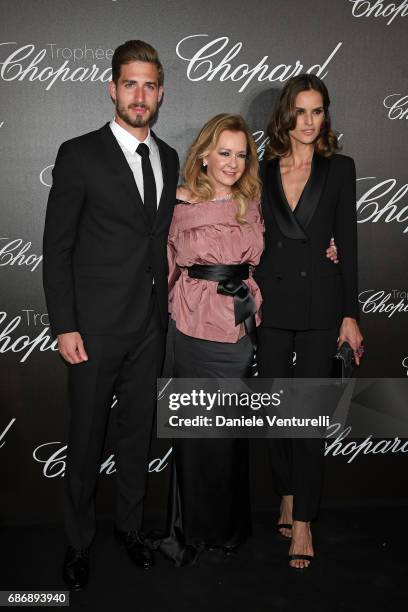 Kevin Trapp, Caroline Scheufele and Izabel Goulart attend the Chopard Trophy photocall at Hotel Martinez on May 22, 2017 in Cannes, France.