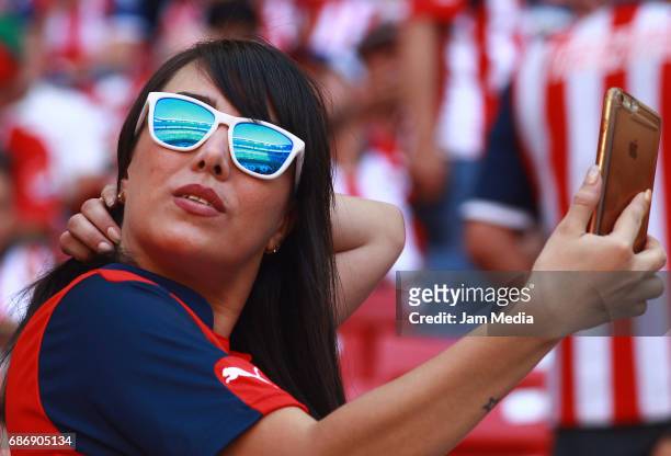 Fan of Chivas takes a selfie during the semi final second leg match between Chivas and Toluca as part of the Torneo Clausura 2017 Liga MX at Chivas...