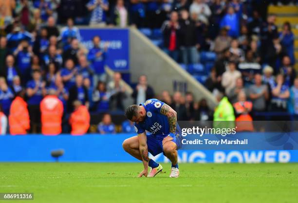 An emotional Marcin Wasilewski of Leicester City crouches down in the centre circle after the Premier League match between Leicester City and AFC...