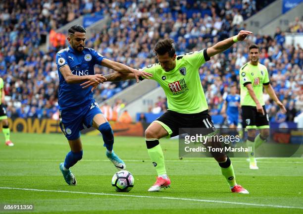 Riyad Mahrez of Leicester City tackles Charlie Daniels of AFC Bournemouth during the Premier League match between Leicester City and AFC Bournemouth...