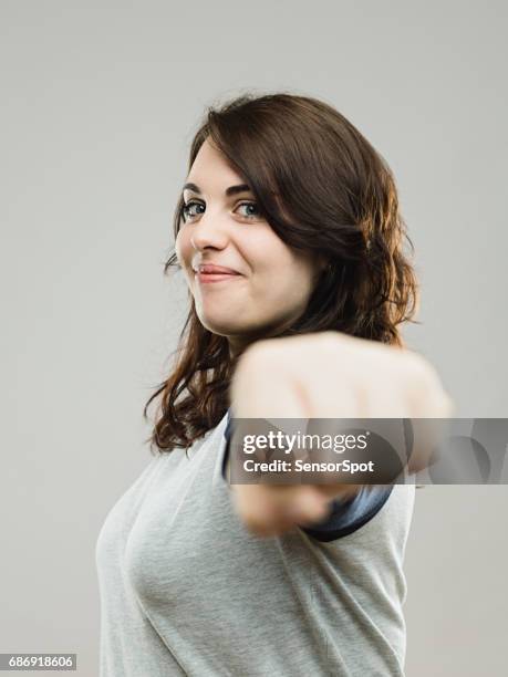 real woman ready for fight - fist bump stock pictures, royalty-free photos & images