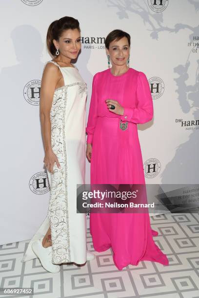 Lola Karimova-Tillyaeva and Kristin Scott Thomas attend The Harmonist Gala Event during the 70th annual Cannes Film Festival at Club Albane on May...