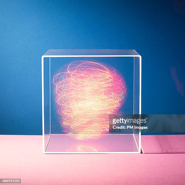 energy in a box - leuchtende farbe stock-fotos und bilder