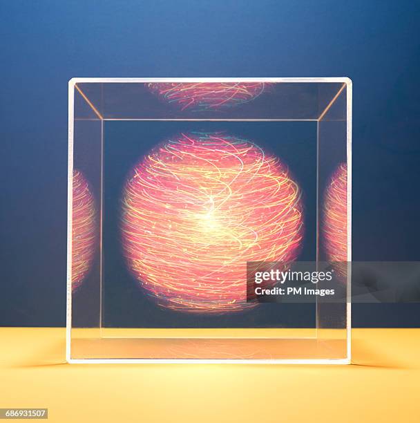 colorful energy orb in a box - coloursurgetrend stock-fotos und bilder