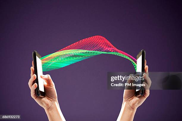 two connected smart phones - data privacy foto e immagini stock