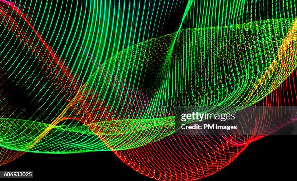 abstract light trails, red and green - green light wave stock pictures, royalty-free photos & images