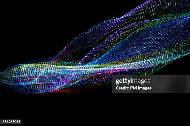 flowing multi colored lights - optic network stock pictures, royalty-free photos & images