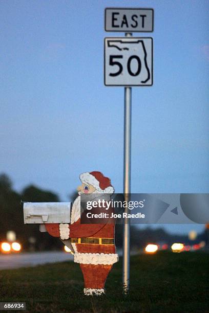 Santa Claus mail box sits next to the State Road 50 sign December 11, 2001 in Christmas, FL. This community of about 3,000 people is roughly midway...