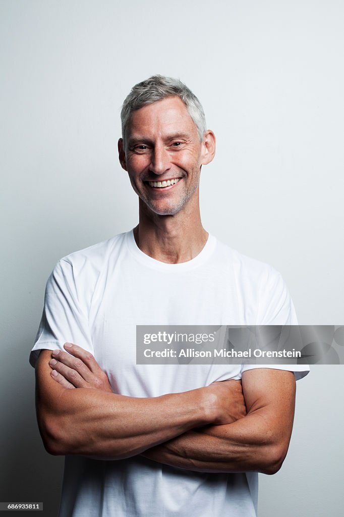 Portrait of man in white t-shirt in his 50's