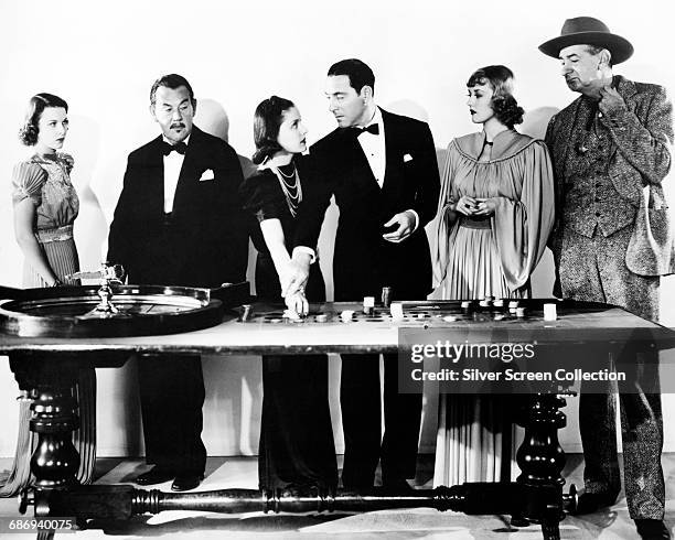 Publicity still for the film 'Charlie Chan in Reno', 1939. From left to right, actors Pauline Moore, Sidney Toler , Kay Linaker, Ricardo Cortez,...