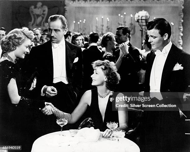 From left to right, Constance Bennett as Griselda Vaughn, Melvyn Douglas as Larry Blake, Greta Garbo as Karin Borg Blake and Robert Sterling as Dick...