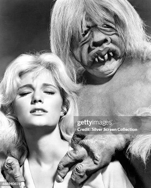 American actress Yvette Mimieux as Weena, being menaced by a Morlock in a publicity still for the 1960 film 'The Time Machine', based on the 1895...